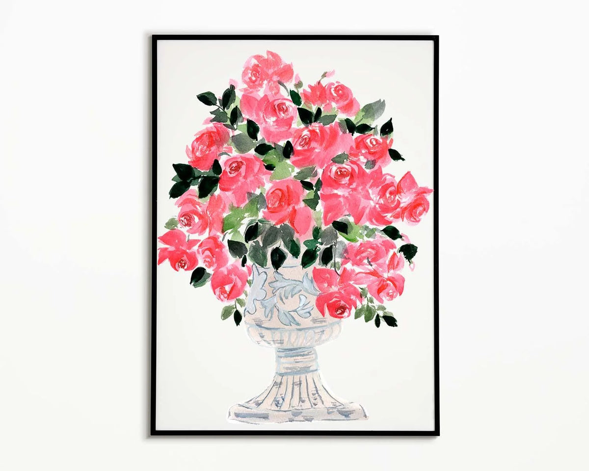 Pink rose bouquet in a decorative pedestal vase, shown in a black-framed art print.
