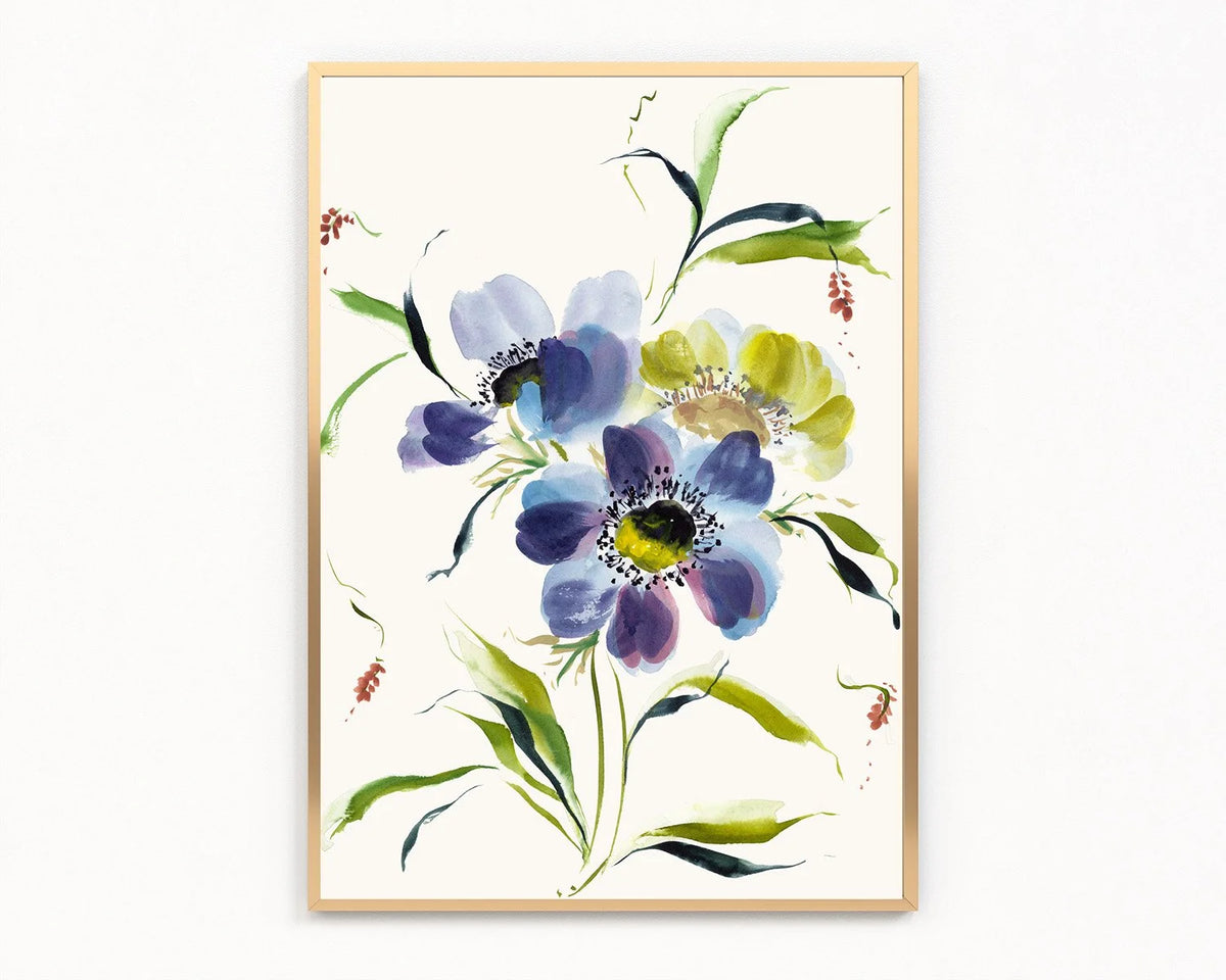 Gold-framed print of blue and purple anemones with a yellow bloom and green leaves on ivory.