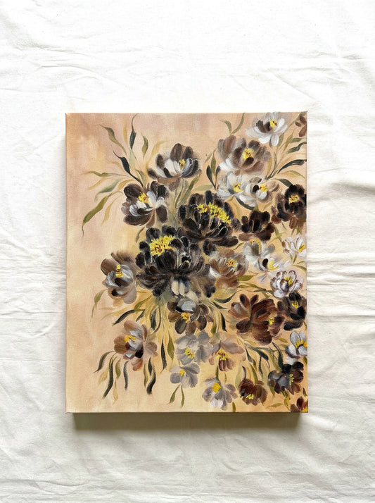 A vertical canvas painting featuring a dense floral bouquet with dark brown, black, white, and gray blossoms with yellow centers and green leaves, set against a warm beige background. A perfect moody study