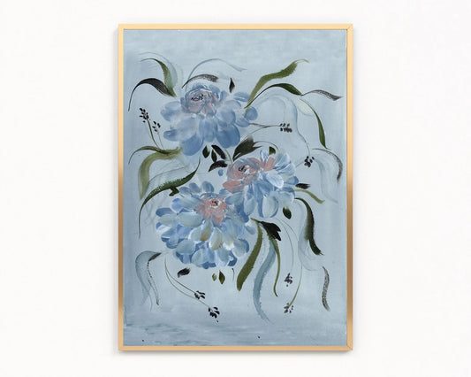 Gold-framed print of blue ranunculus and flowing green leaves on a pale blue background.