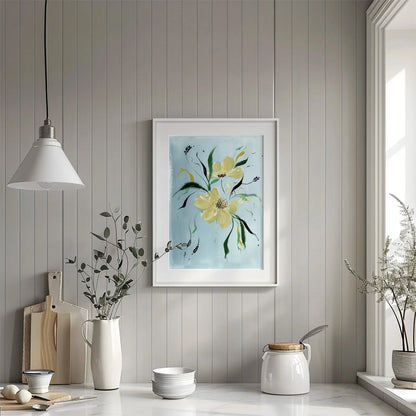 Yellow wildflower print in a white matted frame above a kitchen counter.