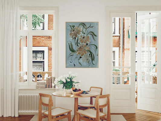 Brown ranunculus print on pale blue above a round dining table between two windows.