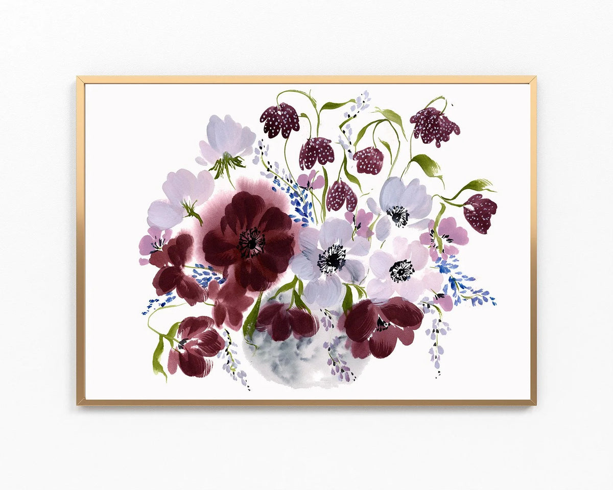 Horizontal gold-framed print of burgundy and pale purple flowers with blue sprigs in a gray vase.