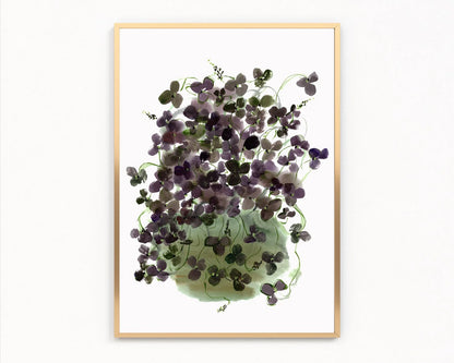 Gold-framed print of dark purple clover leaves spilling from a pale green vase.