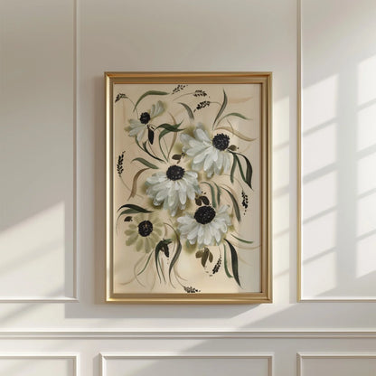 White daisy print in a brass-colored frame on a sunlit paneled wall.