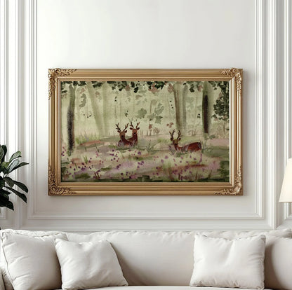 A framed watercolor painting of deer in a forest, displayed on a white wall above a white sofa with pillows.