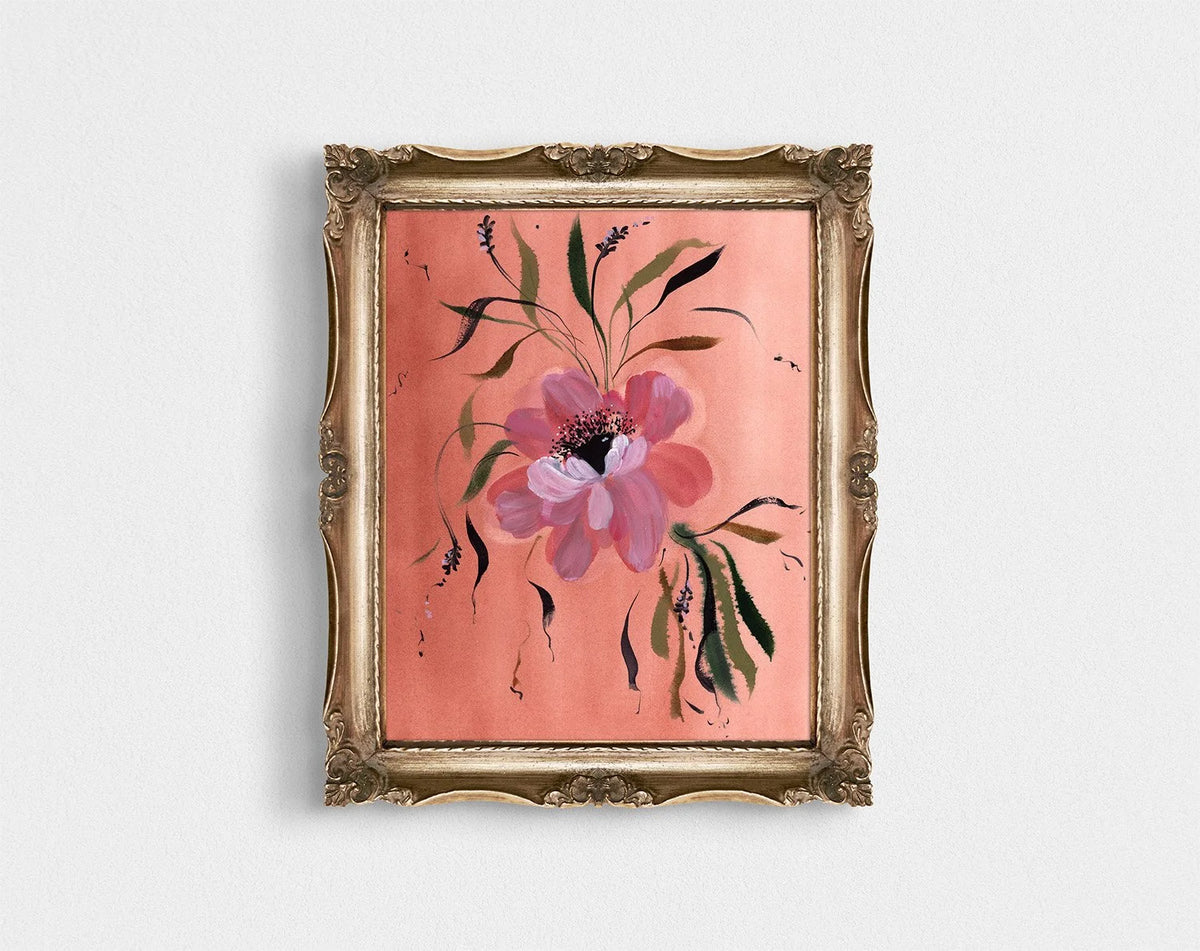 Pink anemone print on coral in an ornate gold frame.
