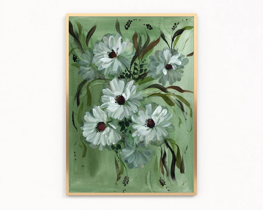 Gold-framed print of white daisies with dark centers and sweeping leaves on green.