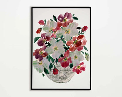 Black-framed print of burgundy and white hellebores with green leaves in a patterned vase.