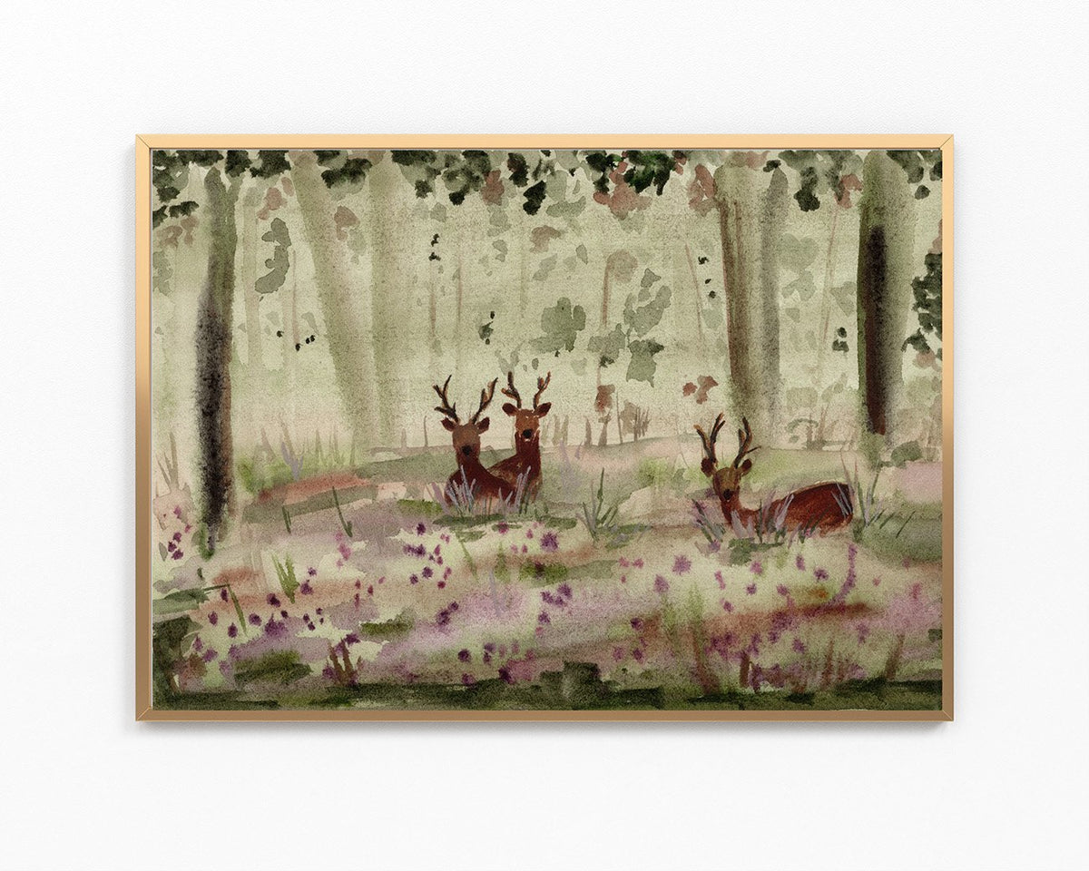A framed watercolor painting of a forest scene with deer among trees and purple wildflowers, shown against a plain white background.