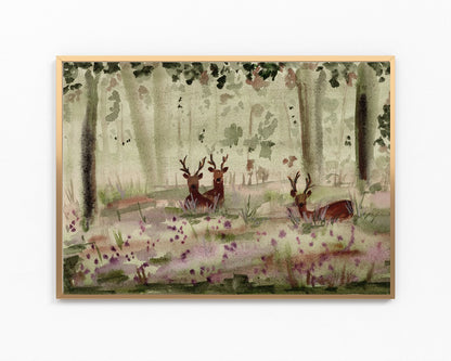 A framed watercolor painting of a forest scene with deer among trees and purple wildflowers, shown against a plain white background.