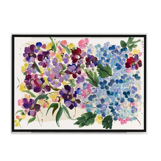 Black-framed floral art print with blue hydrangeas, purple and pink blossoms, and green leaves on an ivory background.