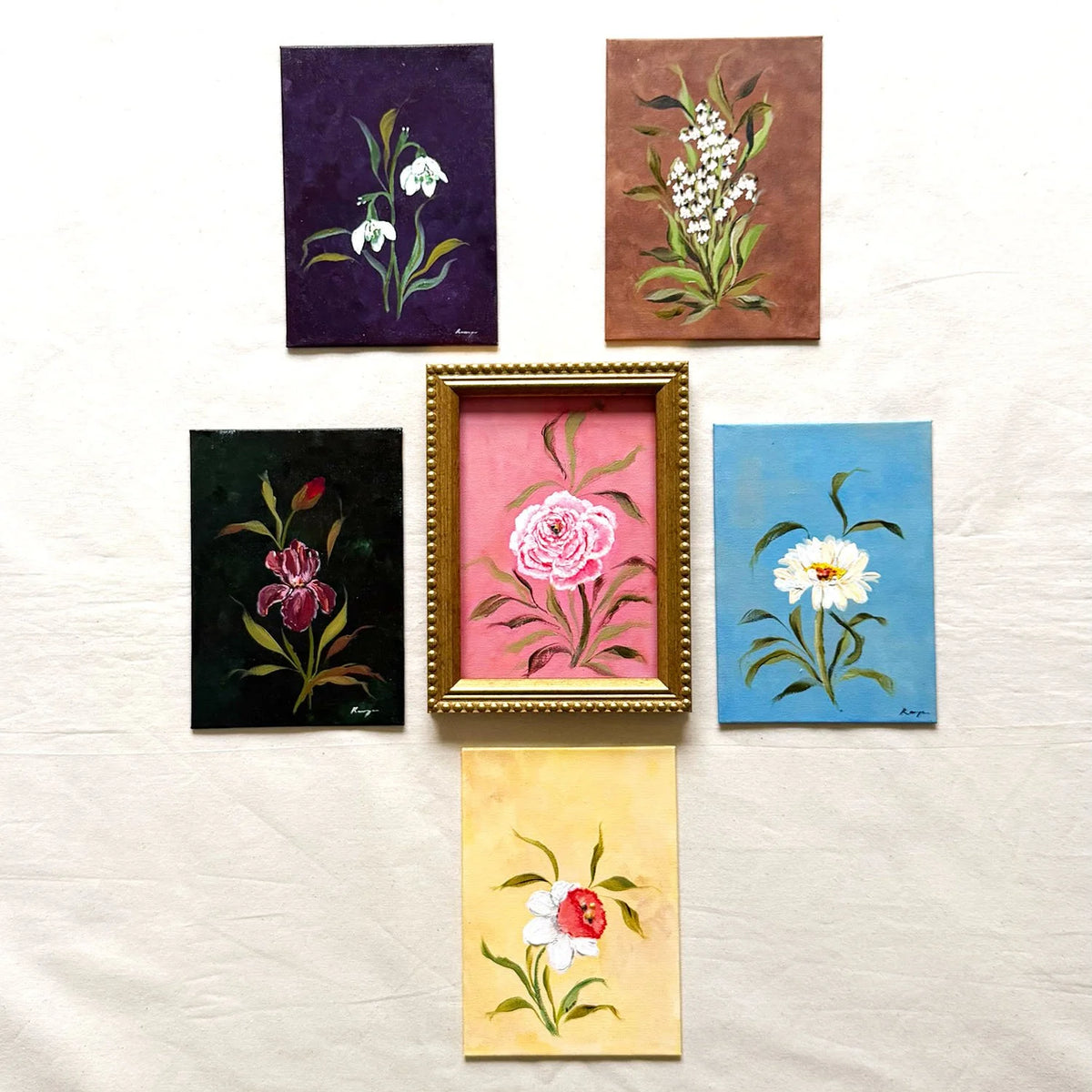 Six originals of flower of the month comes in a beaded gold frame.