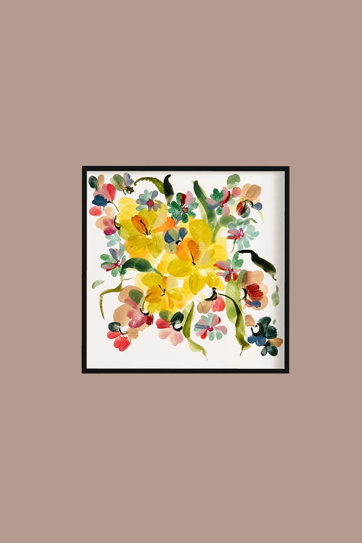 Square yellow narcissus print in a black frame on a warm taupe wall.