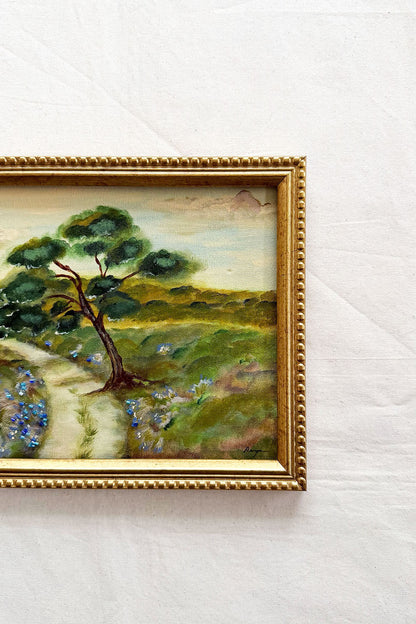Close up of a framed original pastoral landscape painting