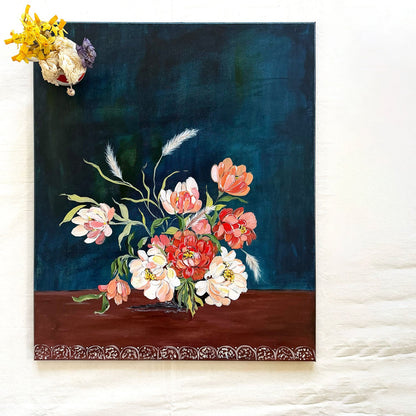 A original 20x24 inches canvas painting featuring a still life floral arrangement with red, pink, and white flowers on a dark blue background and brown base