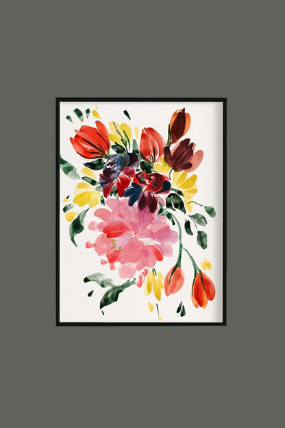 Pink peony and red-orange tulip print in a black frame on a muted green wall.