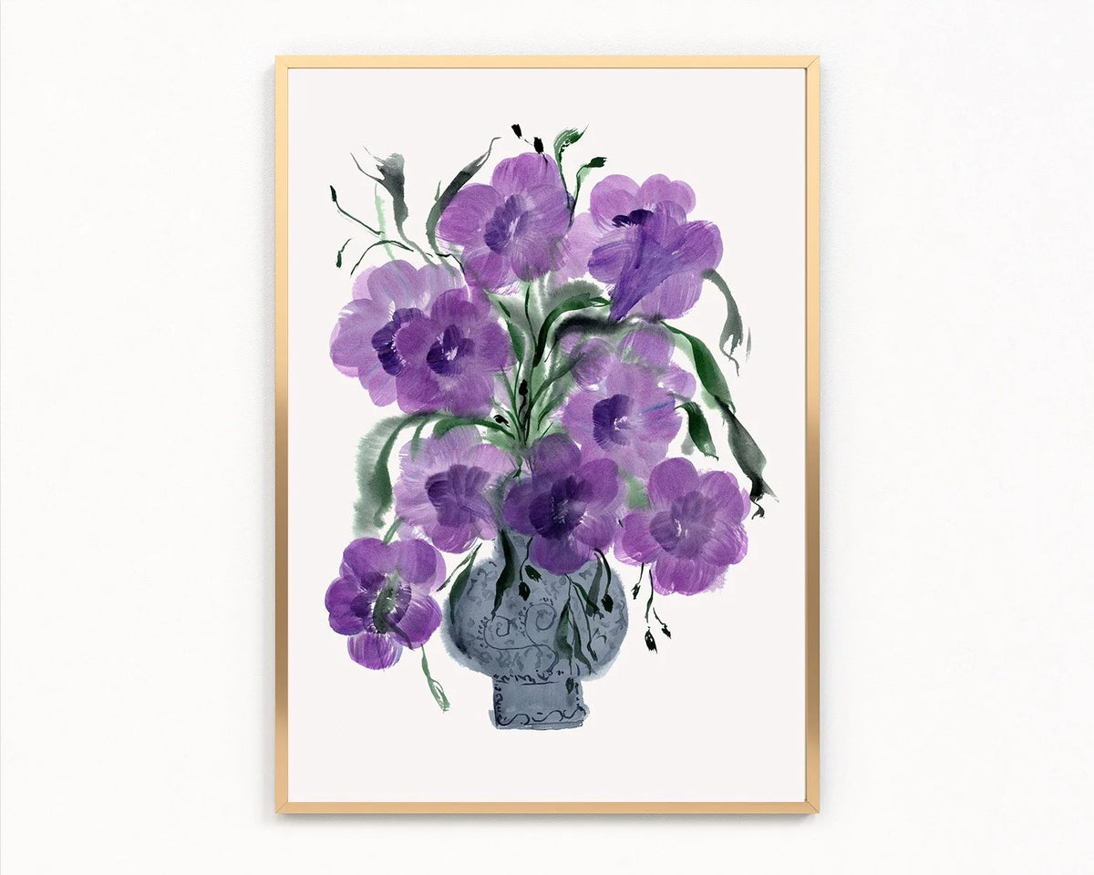 Gold-framed print of purple petunias in a decorative blue-gray vase.
