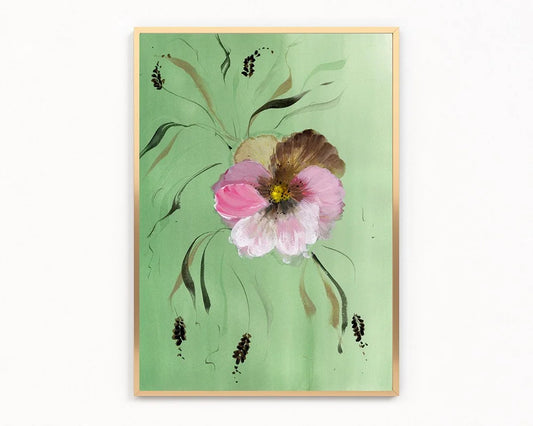 Gold-framed print of a pink and brown pansy with slender leaves on mint green.