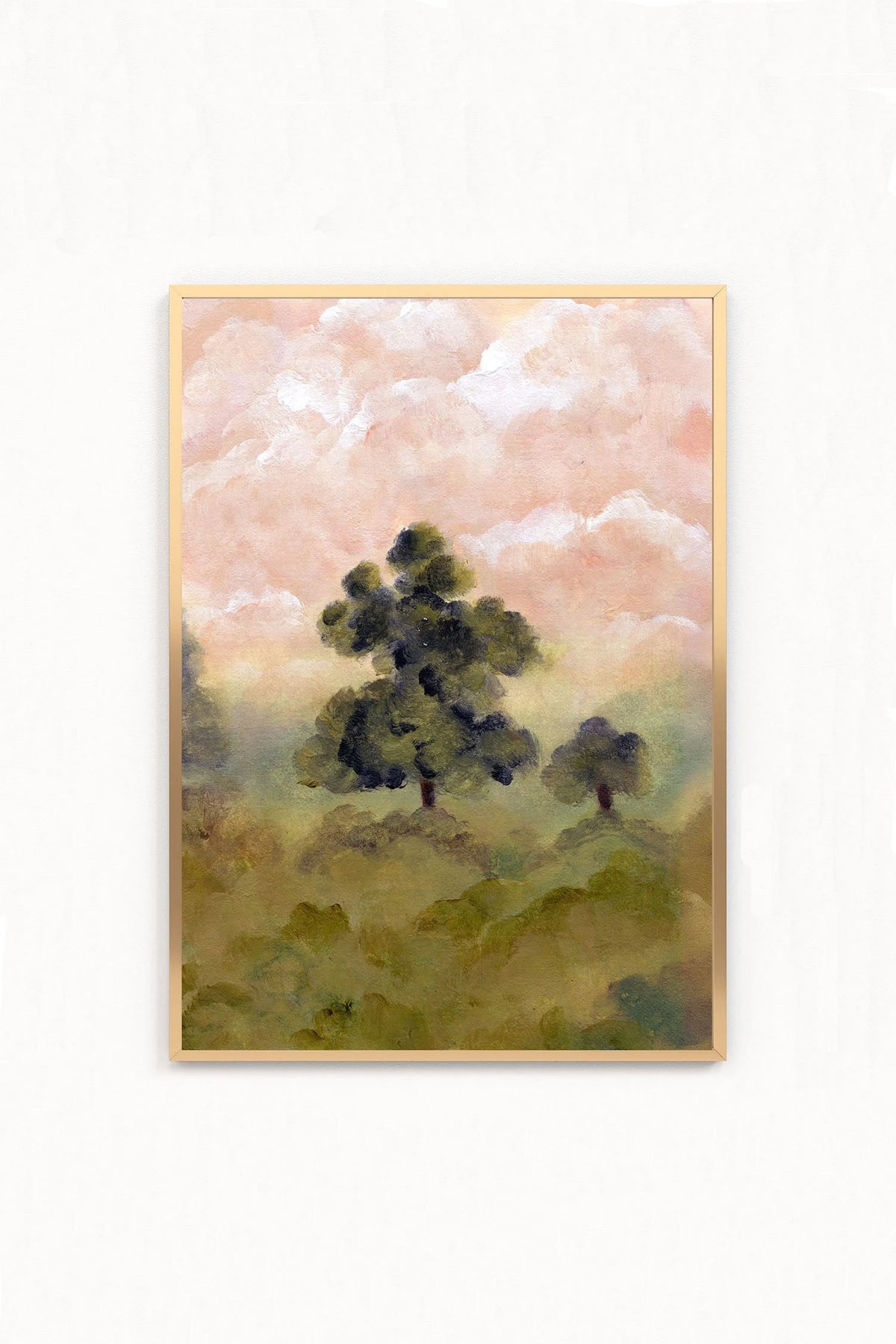 A framed landscape art print featuring dark green trees under a soft pink and white sky,