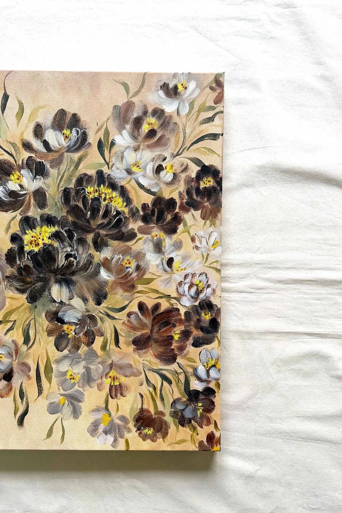 A rectangular floral art print or canvas featuring dark and light flowers on a beige background