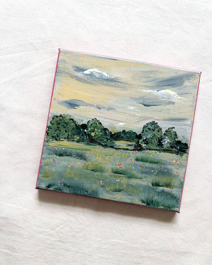 A square canvas painting of a landscape with a grassy field, trees, and a cloudy sky, 