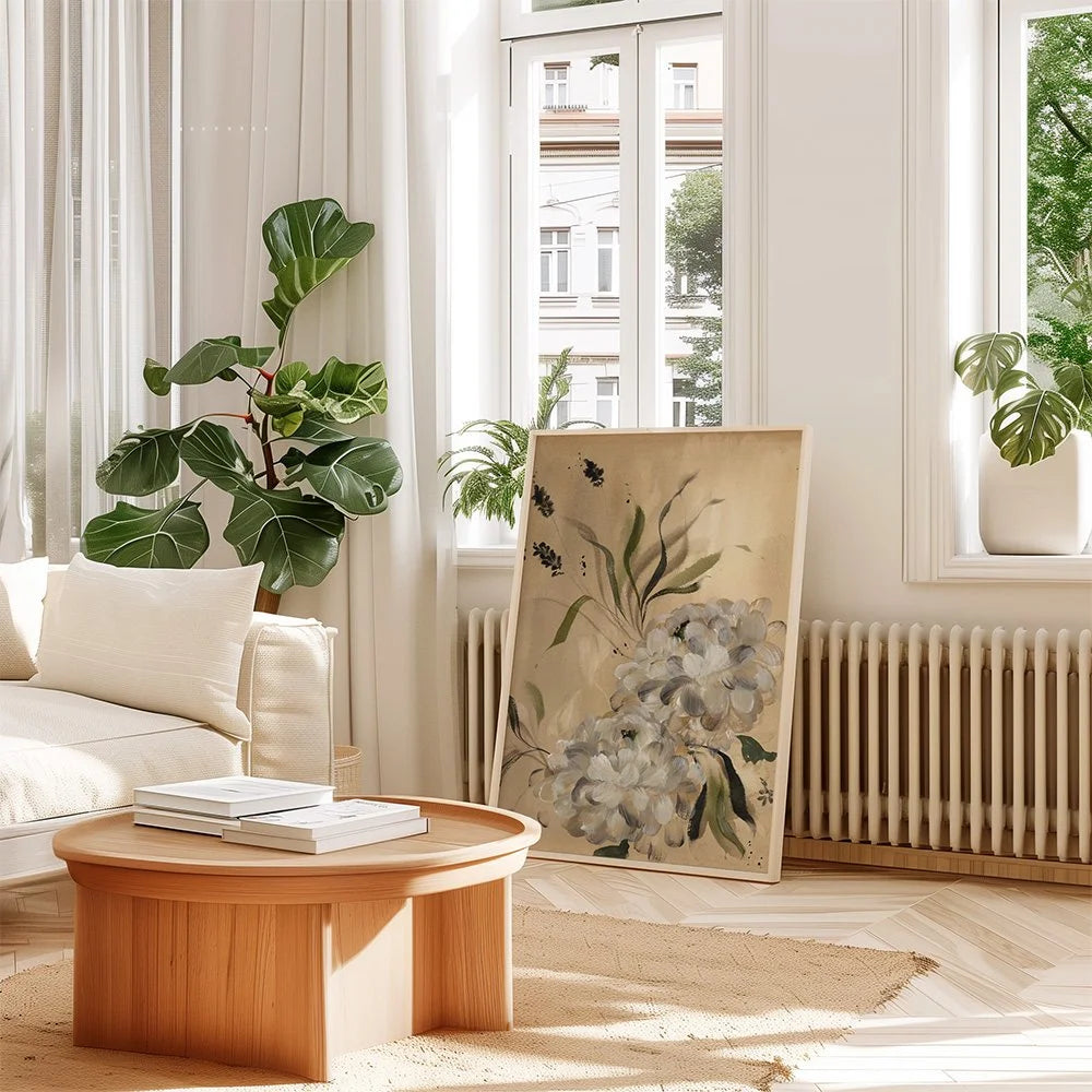 Large white dahlia print on beige leaning beside a radiator in a bright living room.