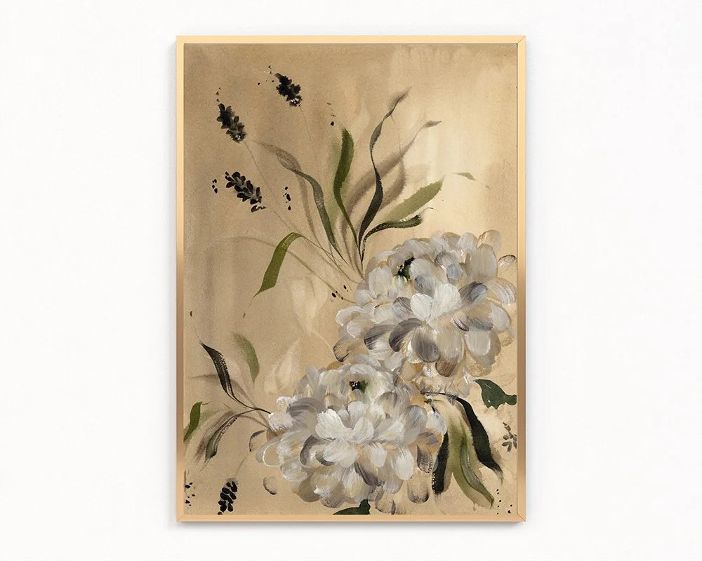 Gold-framed print of two white dahlias with olive leaves and dark sprigs on warm beige.