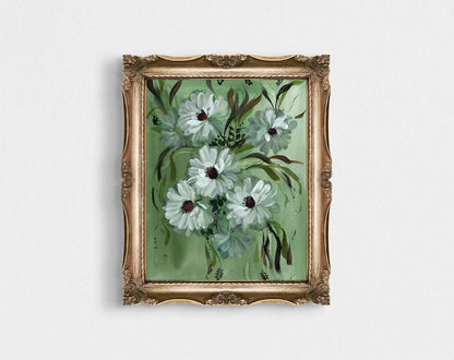 White daisy print on green in an ornate gold frame.