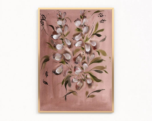 A framed floral art print featuring white blossoms and green leaves on a dusty pink background, enclosed in a light wood frame against a white wall.